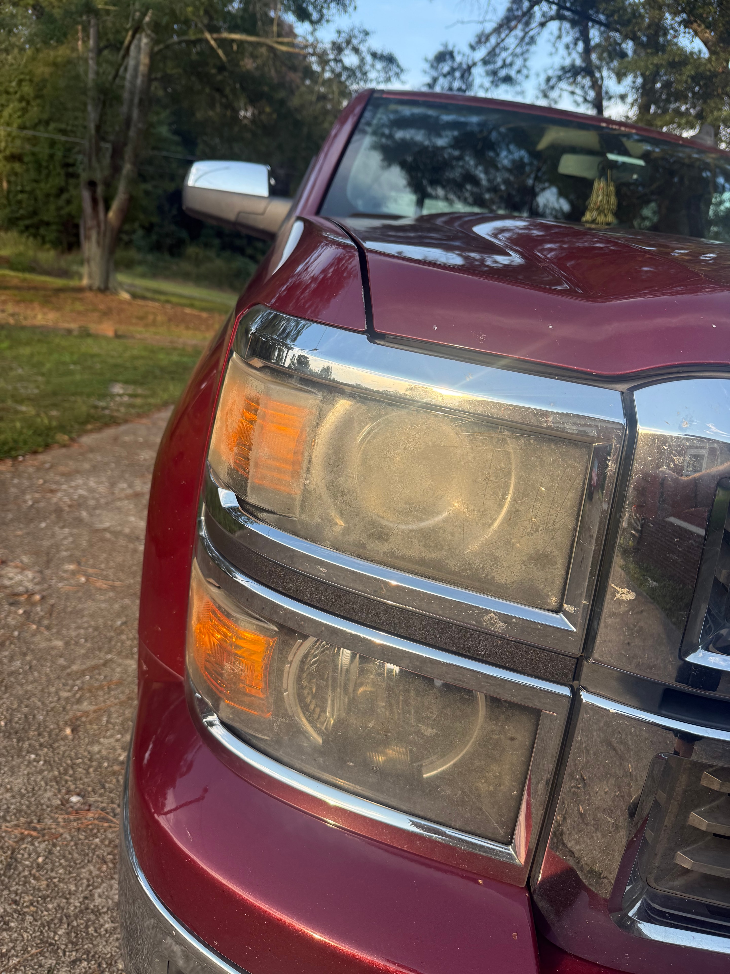 Red vehicle taillights heavily fogged before restoration